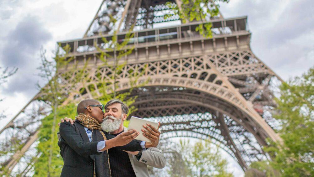 A couple in front of the Eiffel Tower