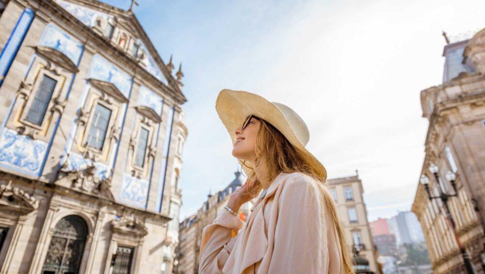 A girl in front of Capela das Almas