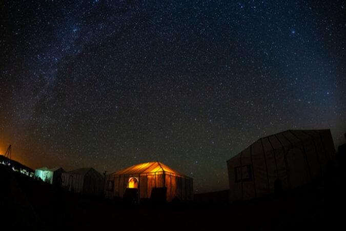The Milky Way over a barber tent in the desert, a must experience duting the Morocco vacation