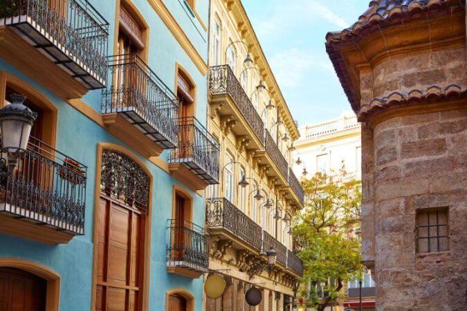 Beautiful colorful houses near Sant Vicent Square in Valencia, a great place to visit during your Spain vacation