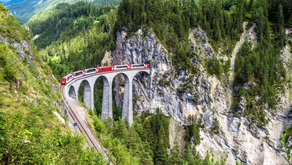 The iconic Glacier Express running on Landwasser Viaduct, something you can't miss on a Switzerland tour