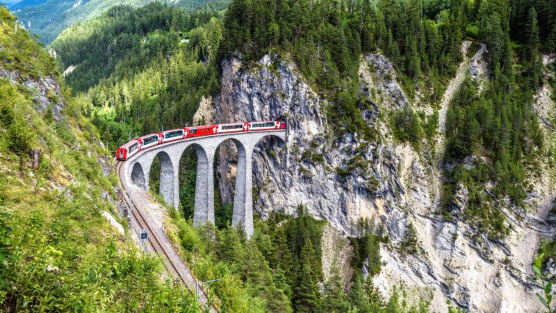 The iconic Glacier Express running on Landwasser Viaduct, something you can't miss on a Switzerland tour