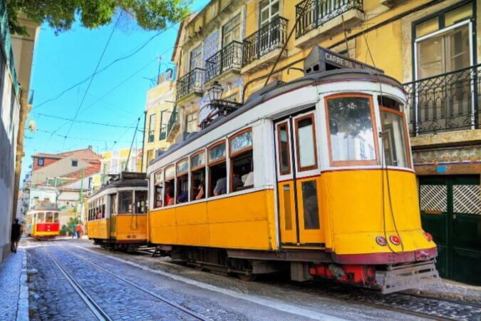 famous yeallow trams in Lisbon, a must-see sight diring any vacation to portugal