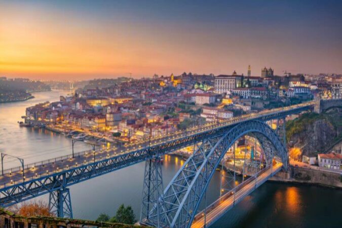 Louis I bridge at dawn, a must-see sight during a vacation to Portugal