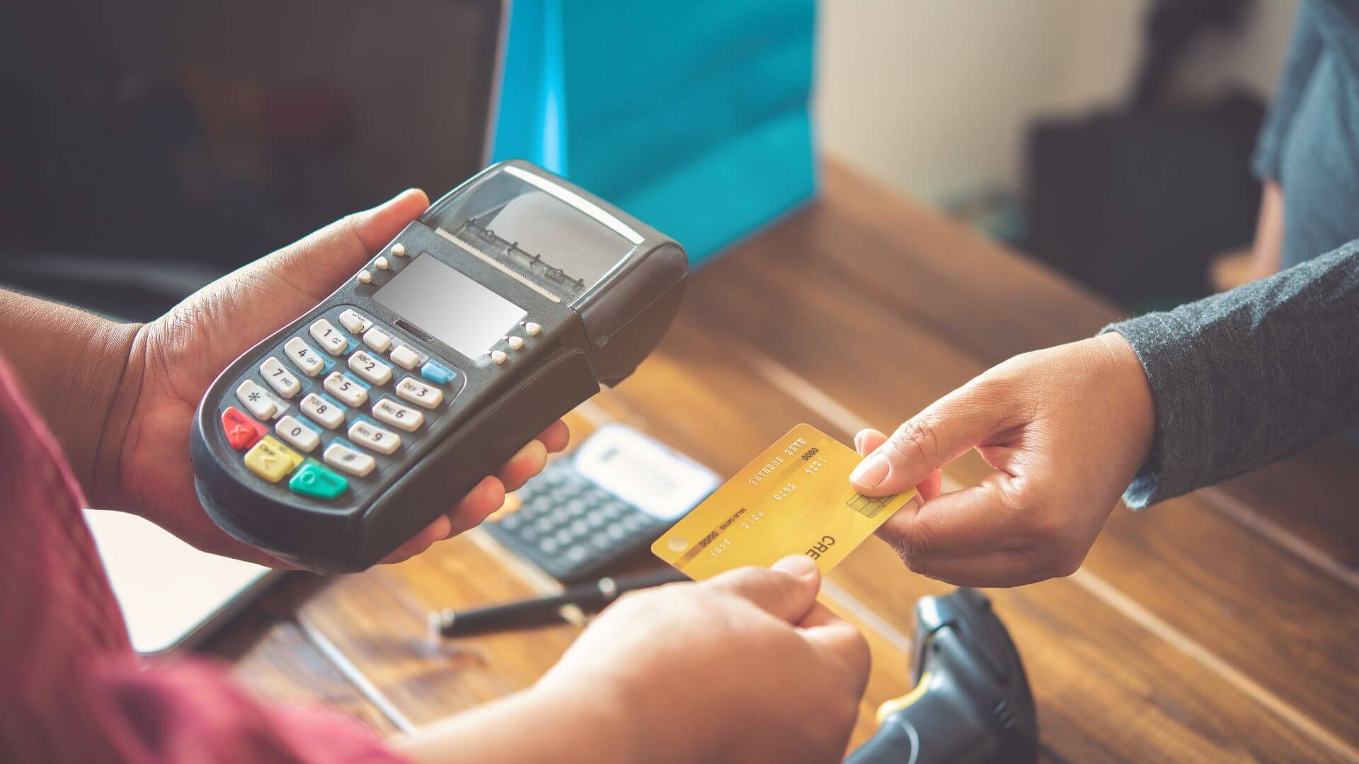 A person paying with a card during their vacation to Europe