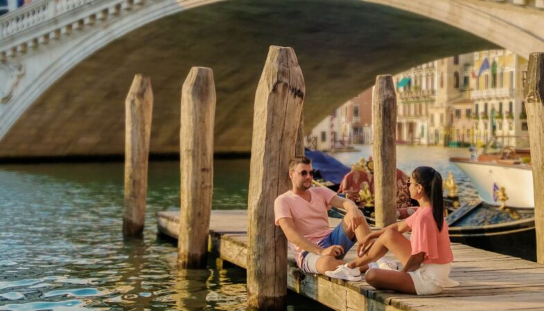 A couple enjoying a quiet evening in Venice during their classic Italy tour